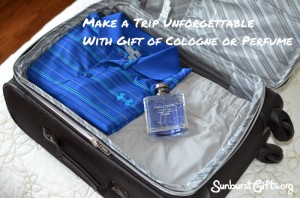 bottle of cologne in luggage on top of clothes